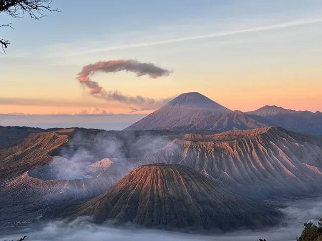 scenic sunrise view of Mount Bromo and surrounding volcanic landscape